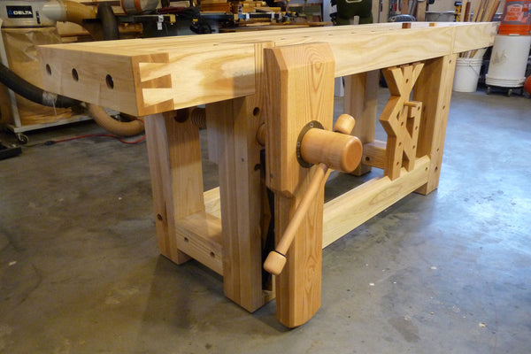 Wooden leg vise installed on a workbench